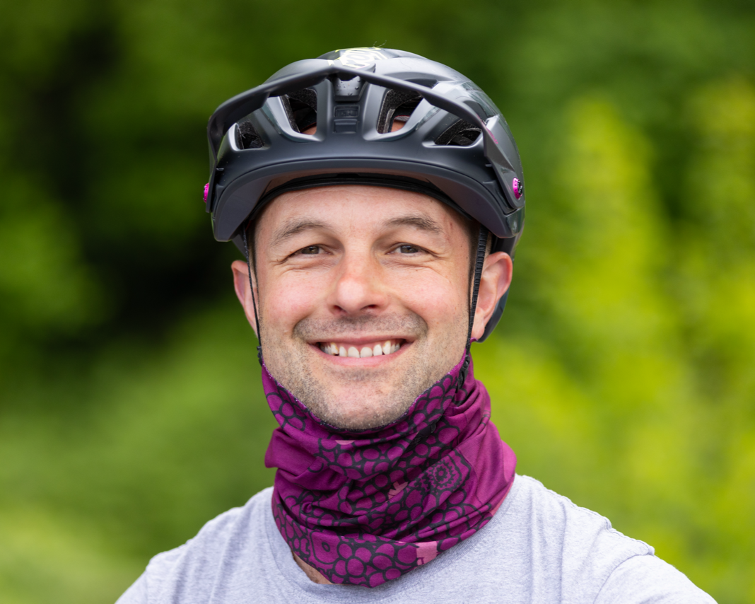 Rider wears Mint Sauce neck tube around neck